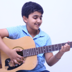 Child Exploring Hobbies in a Classroom