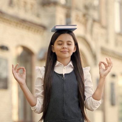 calm mind little child meditation outdoors small girl mudra hands holding book head meditation mental balance meditation course beginner school education best therapy (1)